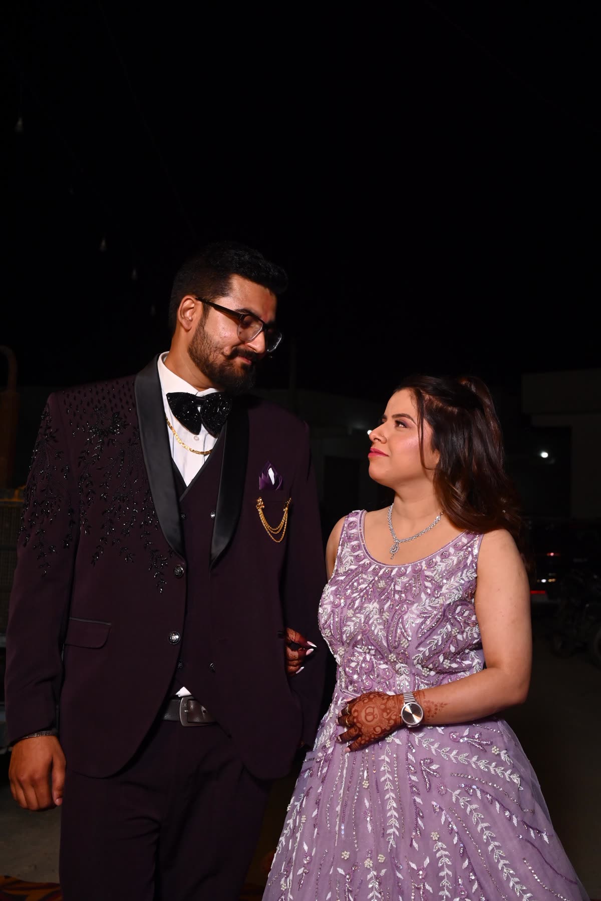 Anukriti and Anmol looking at each other during an evening portrait